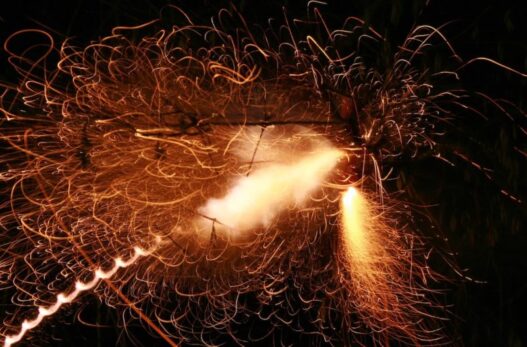 Firecracker exploding in the air e1577307029146