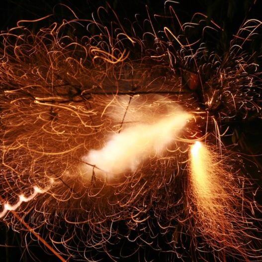 Firecracker exploding in the air e1577307029146