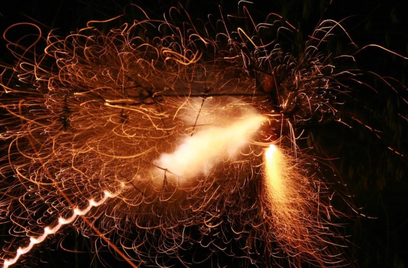 Firecracker exploding in the air e1577307029146